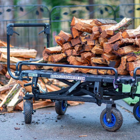 Boundless cargo carrier used as a cart with logs on it
